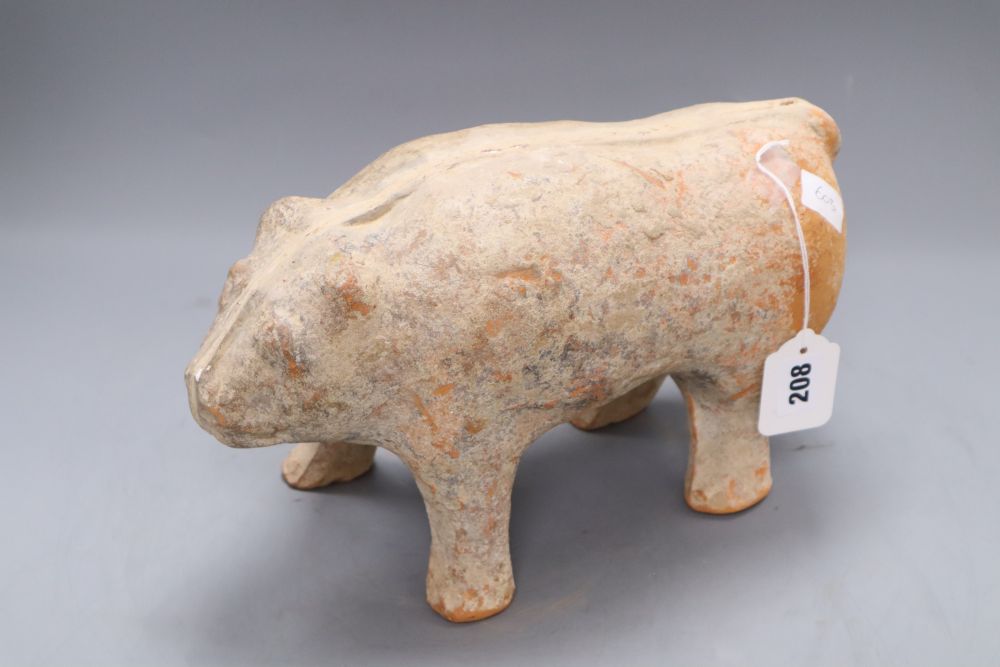 A Chinese pottery figure of a bear, Han dynasty or later, length 33cm